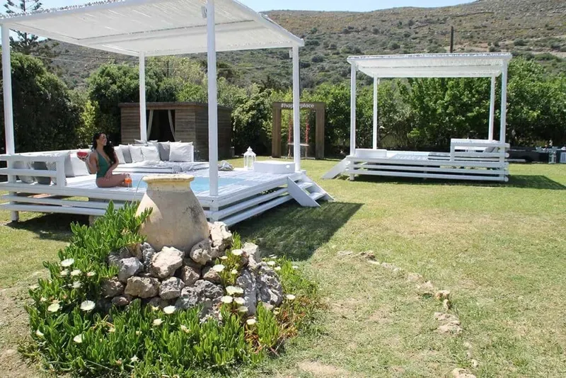 Mediterranean garden with private jacuzzi kiosks in front of each suite