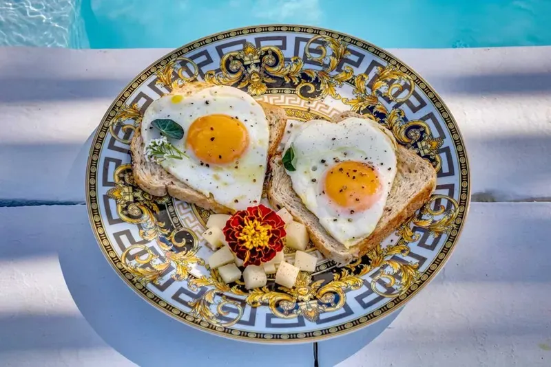Signature breakfast dish on Versace porcelain