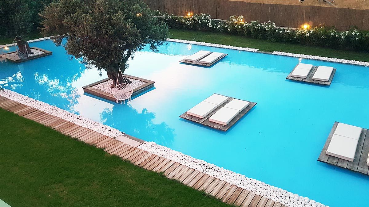 Pool glowing blue in the evening
