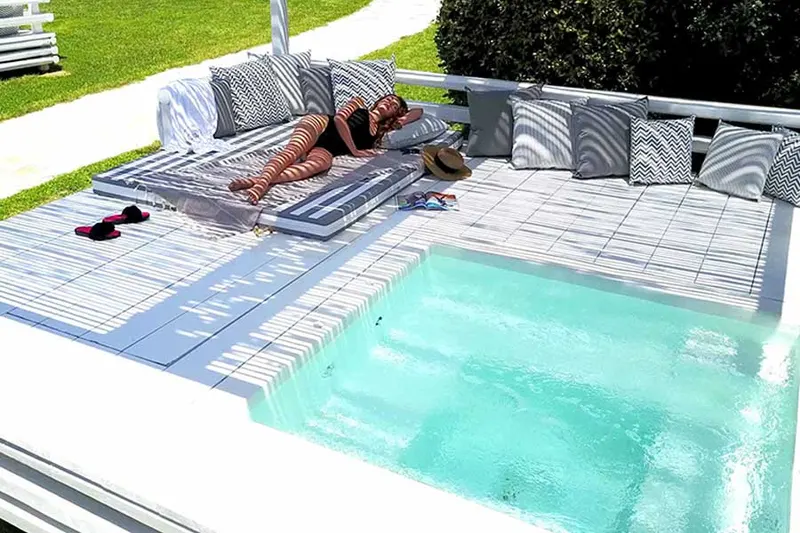 Guest relaxing inside the private jacuzzi kiosk